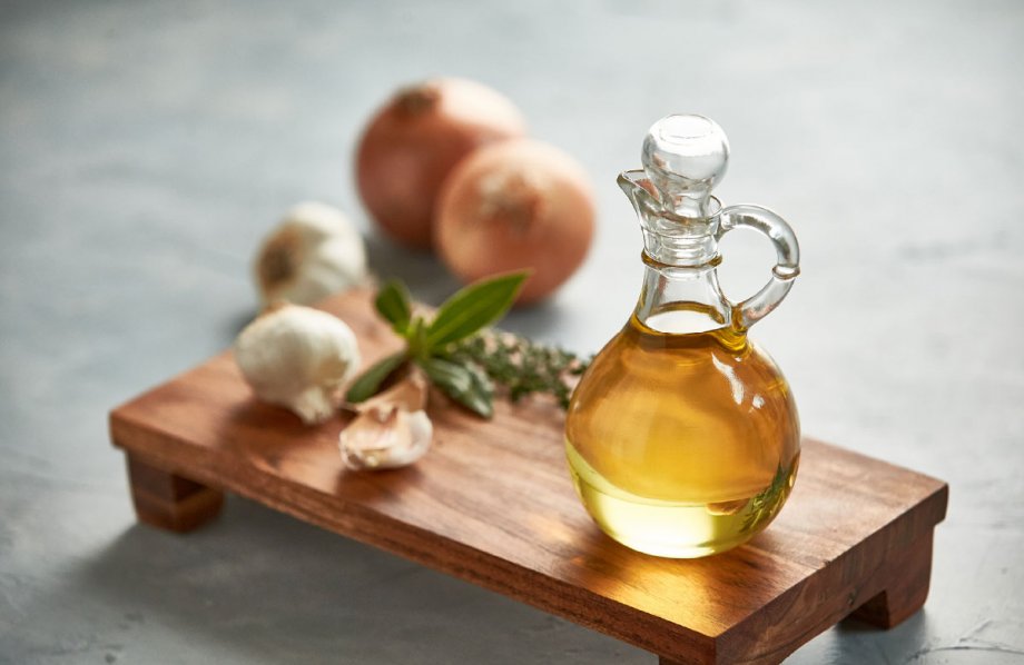 Bottle of cottonseed oil on a cutting board