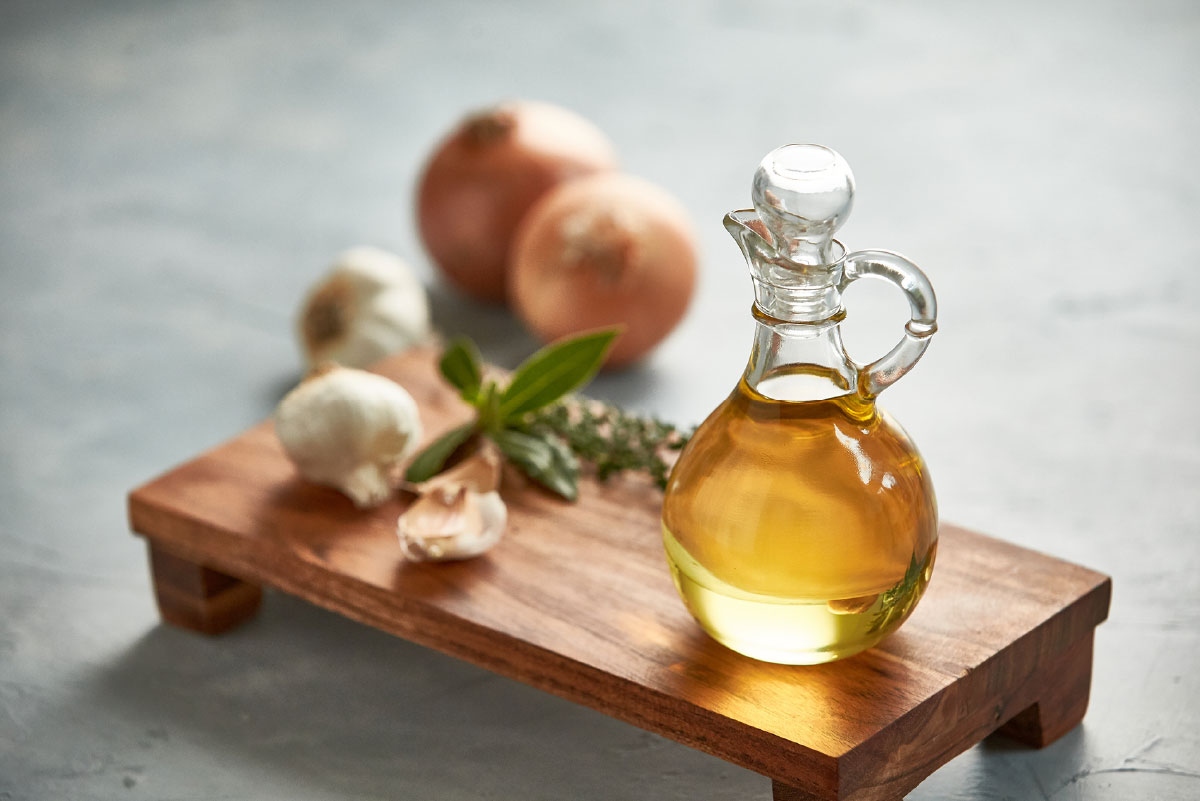 Bottle of cottonseed oil on a cutting board